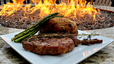 ribeye, asparagus and baked potato at firepit