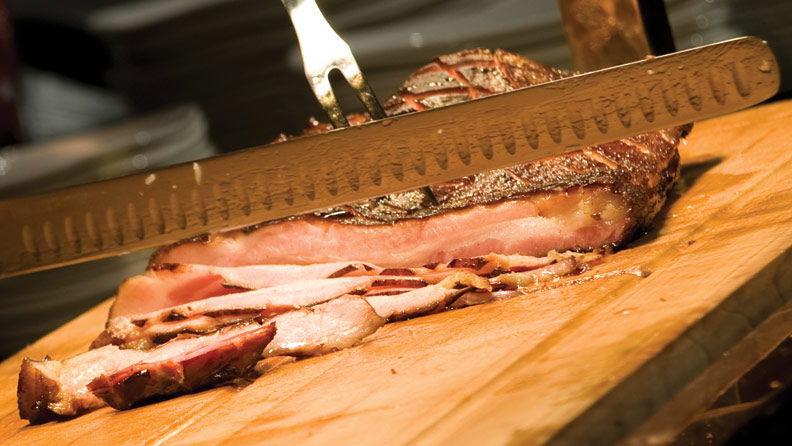 close up of chef carving meat